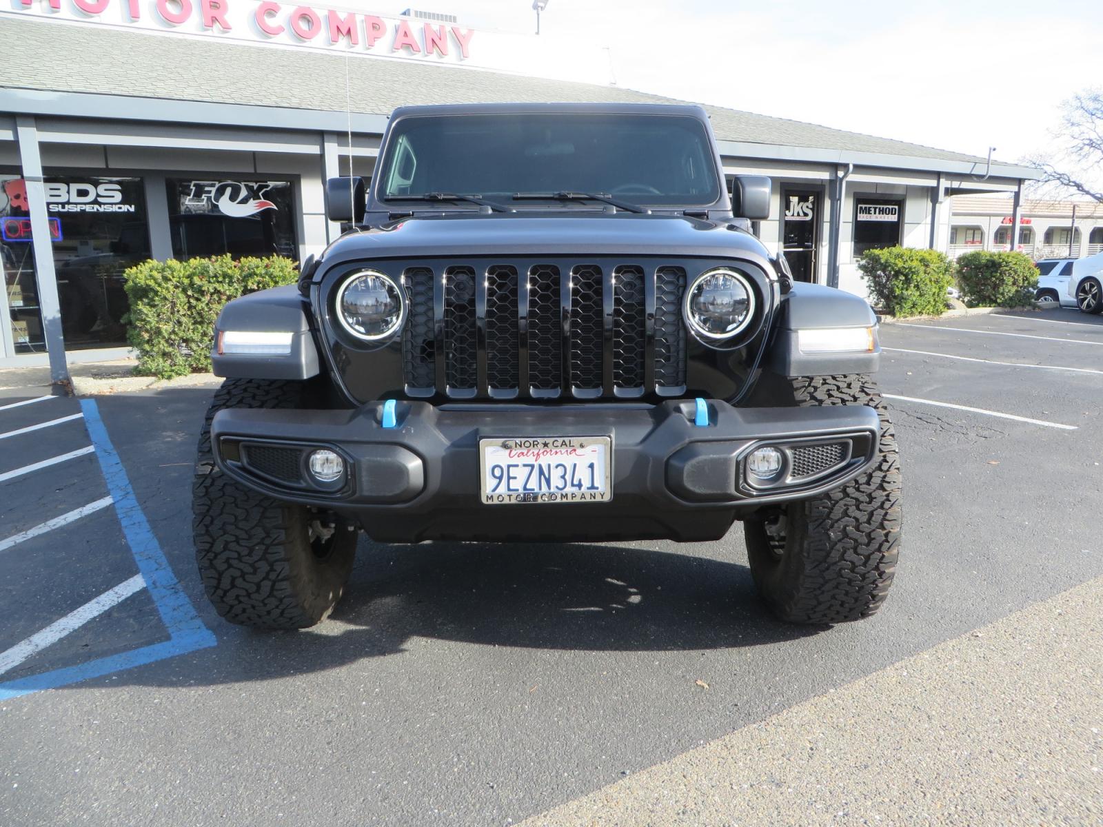 2023 CHARCOAL /black Jeep Wrangler Unlimited Willys 4XE (1C4JJXN68PW) with an 2.0L L4 DOHC 16V HYBRID engine, 8A transmission, located at 2630 Grass Valley Highway, Auburn, CA, 95603, (530) 508-5100, 38.937893, -121.095482 - 3" Zone Offroad lift kit, Fox Adventure series shocks, 17" Method Race wheels, 37" BFG KO2 tires, and a Teraflex spare tire carrier. - Photo #1